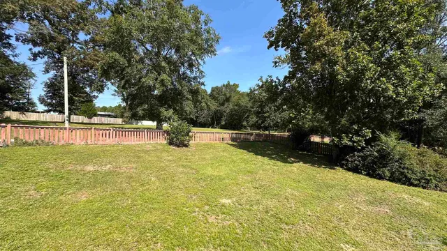 a view of a swimming pool with an outdoor space and seating area