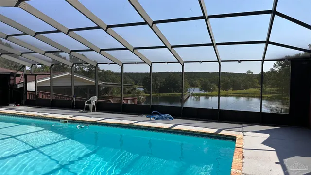 a view of swimming pool with seating space