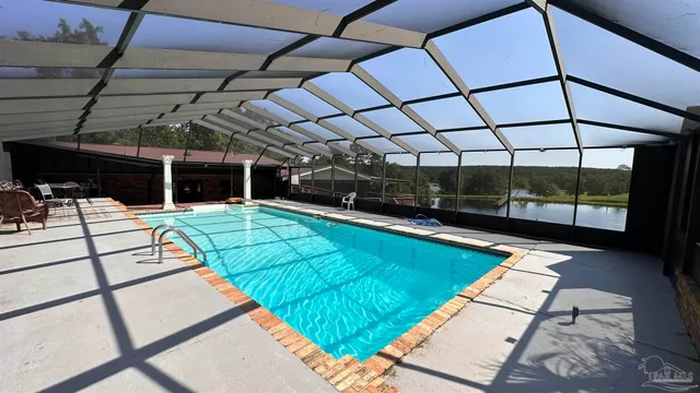 a view of a swimming pool with a patio