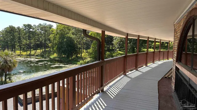 a view of balcony with wooden floor