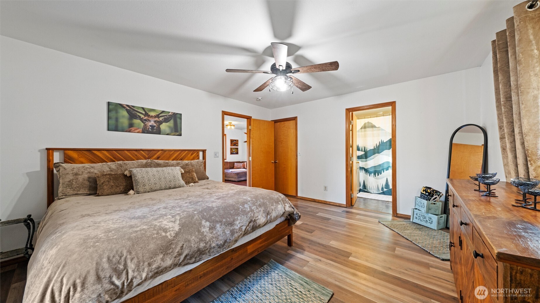 106 Wolf Ridge Lane Dayton, WA 99328 - Photo 17 of 40 a bedroom with a bed and dresser with wooden floor
