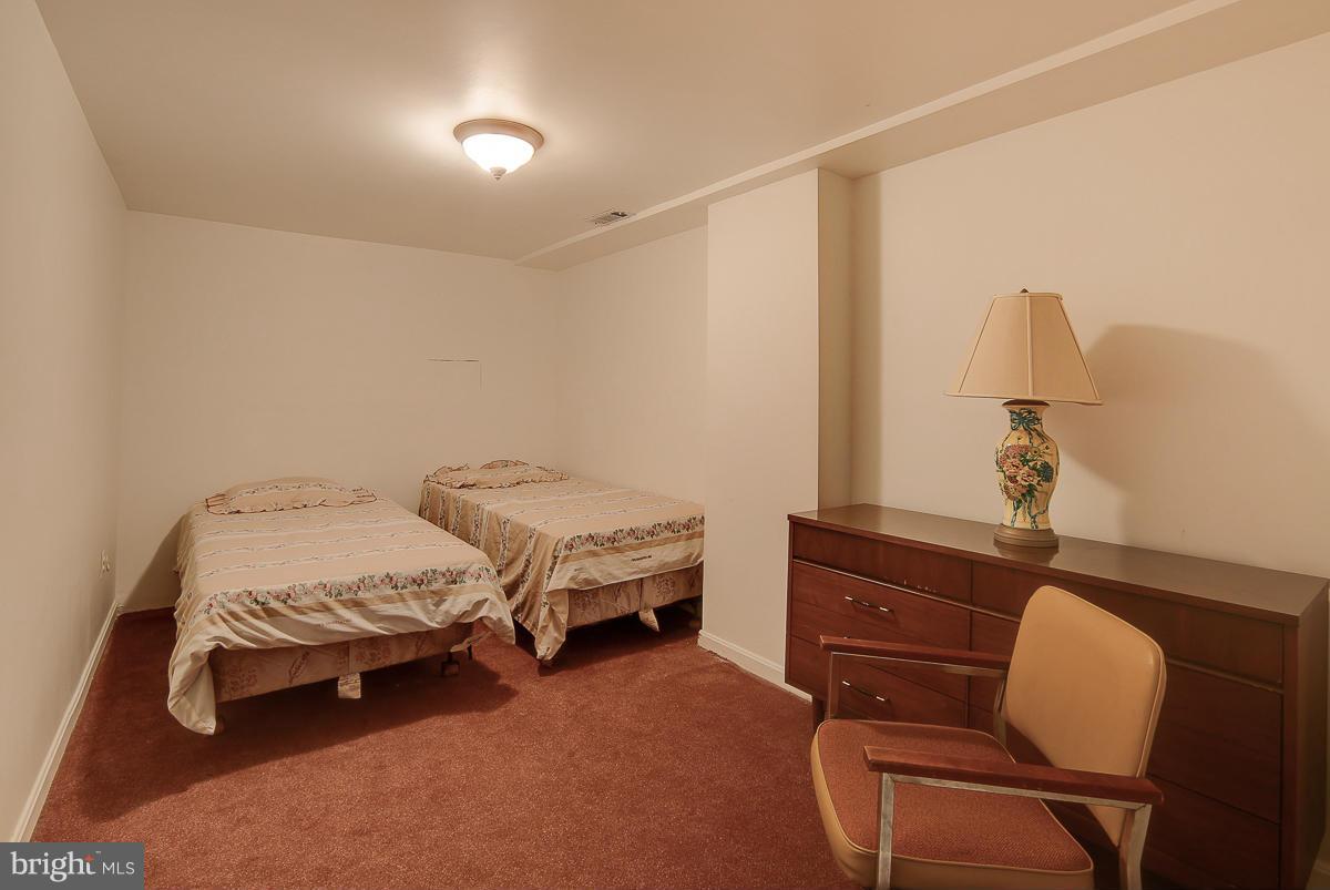 6206 Ivymount Road Baltimore, MD 21209 - Photo 20 of 25 a bedroom with furniture and a window