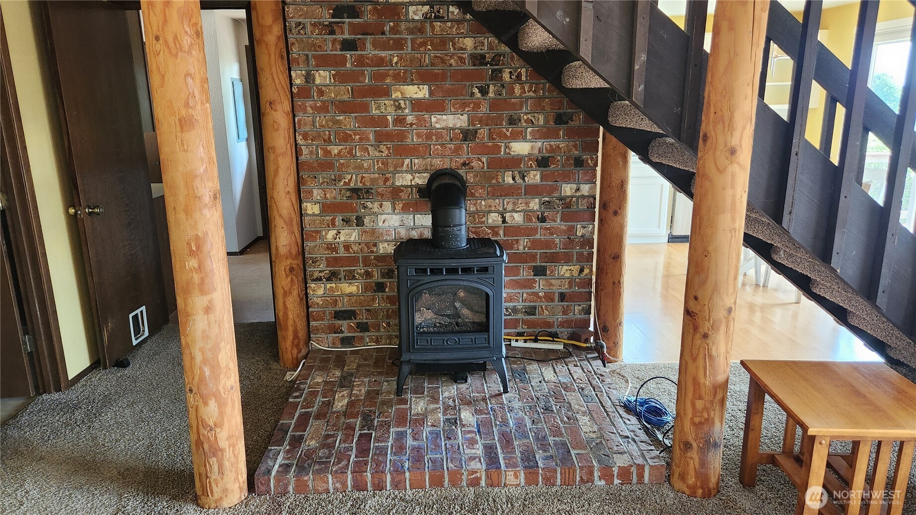 5556 Salish Road Blaine, WA 98230 - Photo 12 of 40 a view of a hallway with wooden floor and stairs