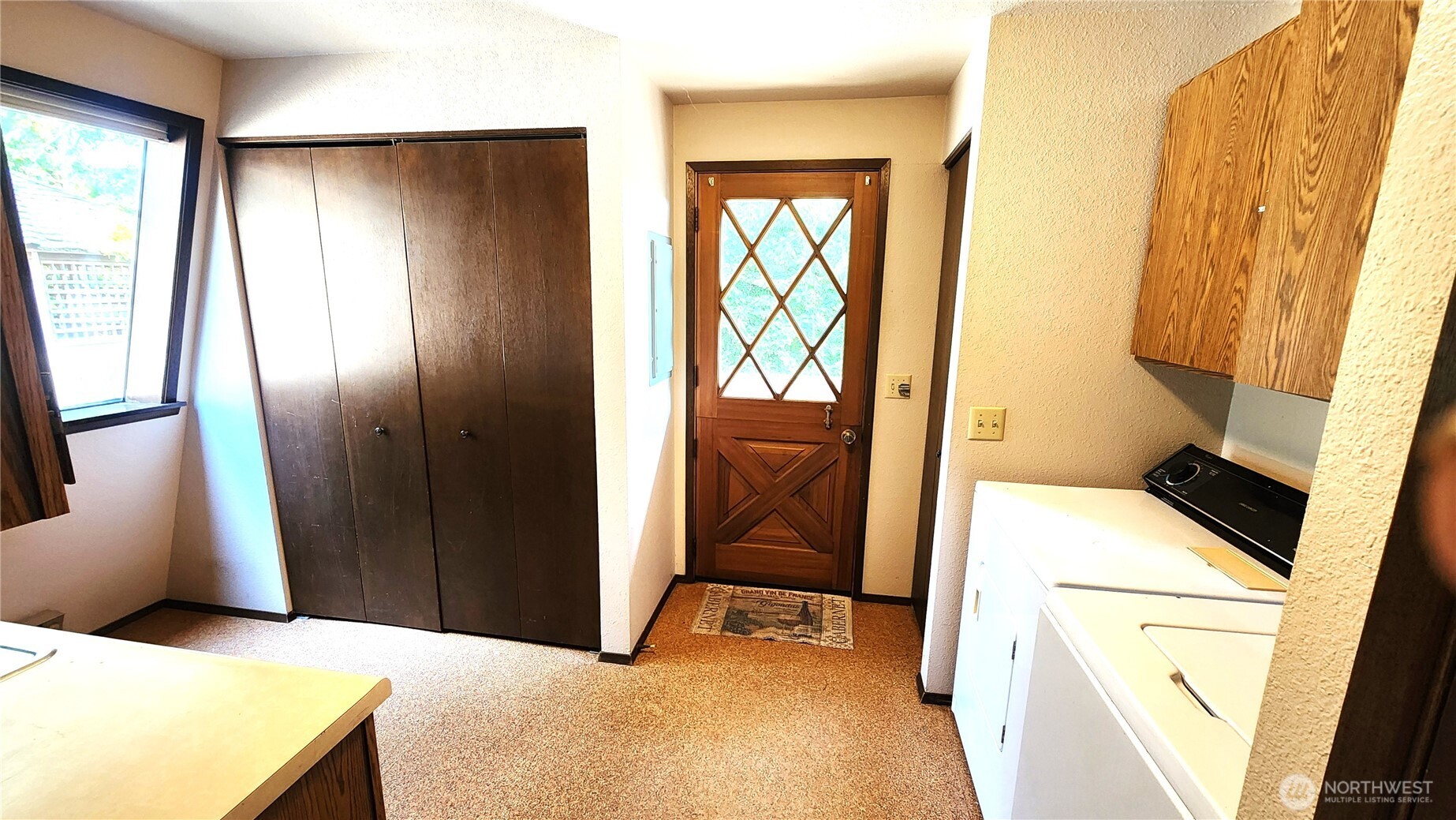 5556 Salish Road Blaine, WA 98230 - Photo 18 of 40 a bedroom with a bed and a large mirror