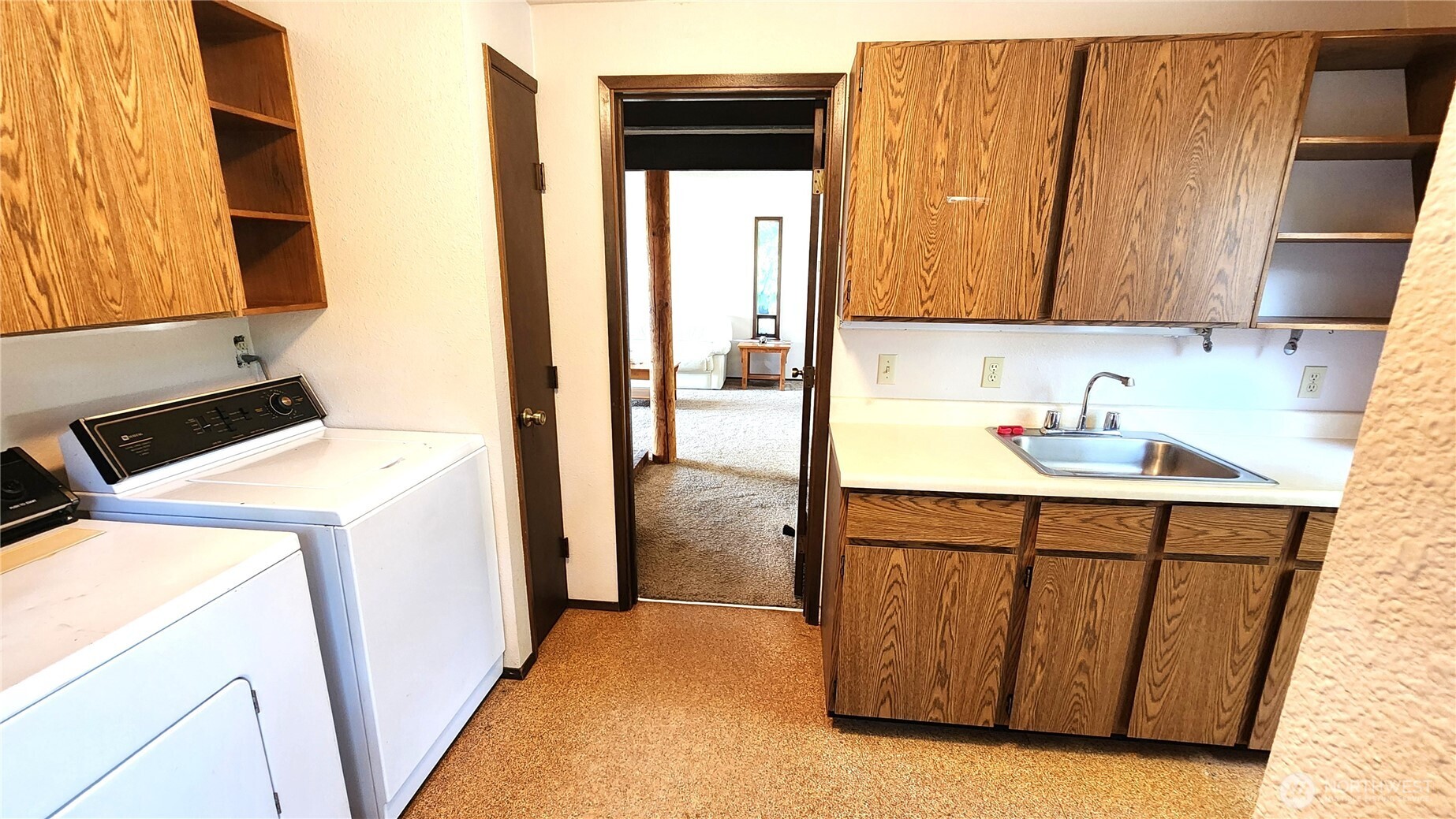 5556 Salish Road Blaine, WA 98230 - Photo 19 of 40 a utility room with a sink washer and dryer