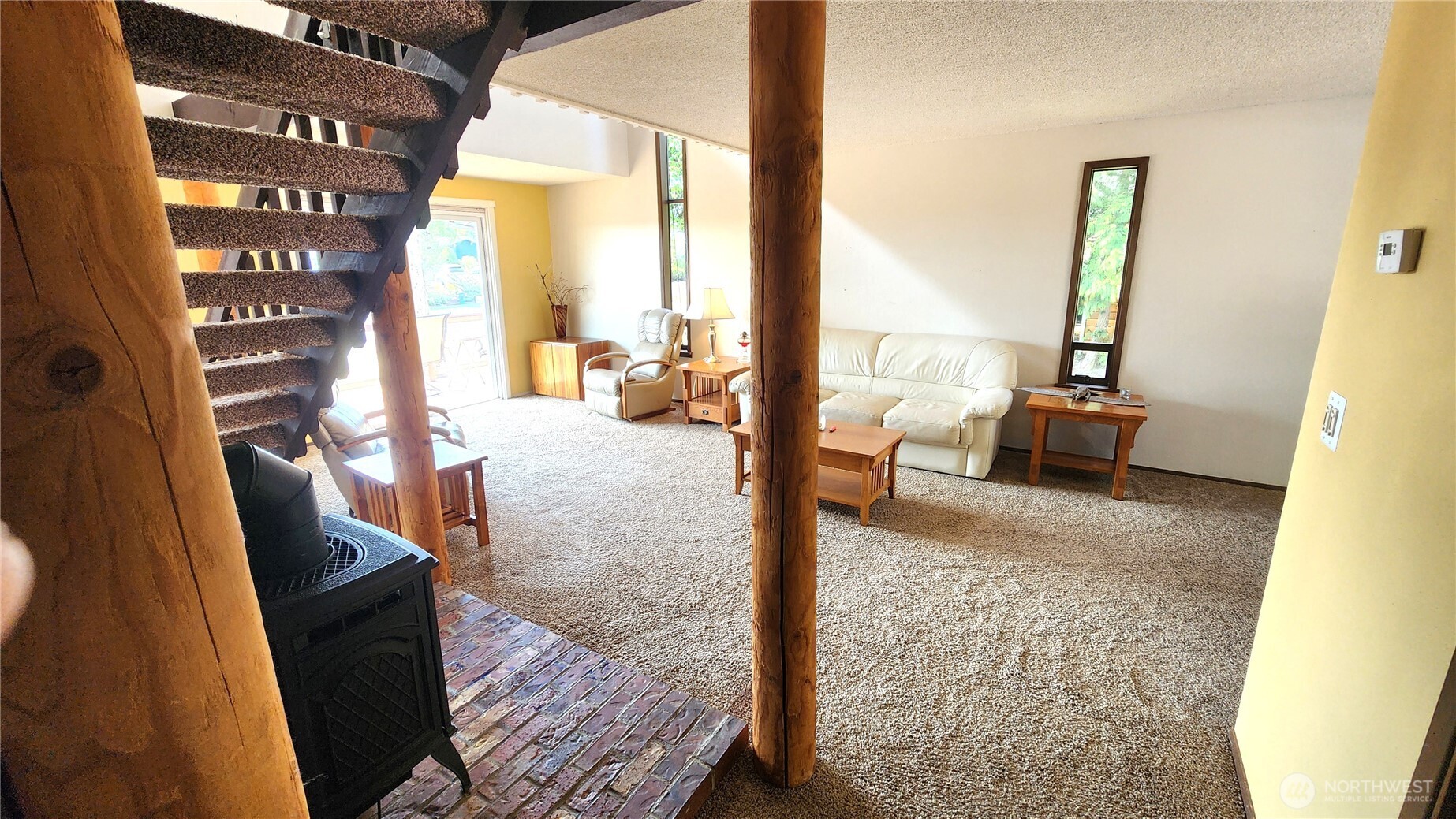 5556 Salish Road Blaine, WA 98230 - Photo 20 of 40 a view of living room with furniture and floor to ceiling window