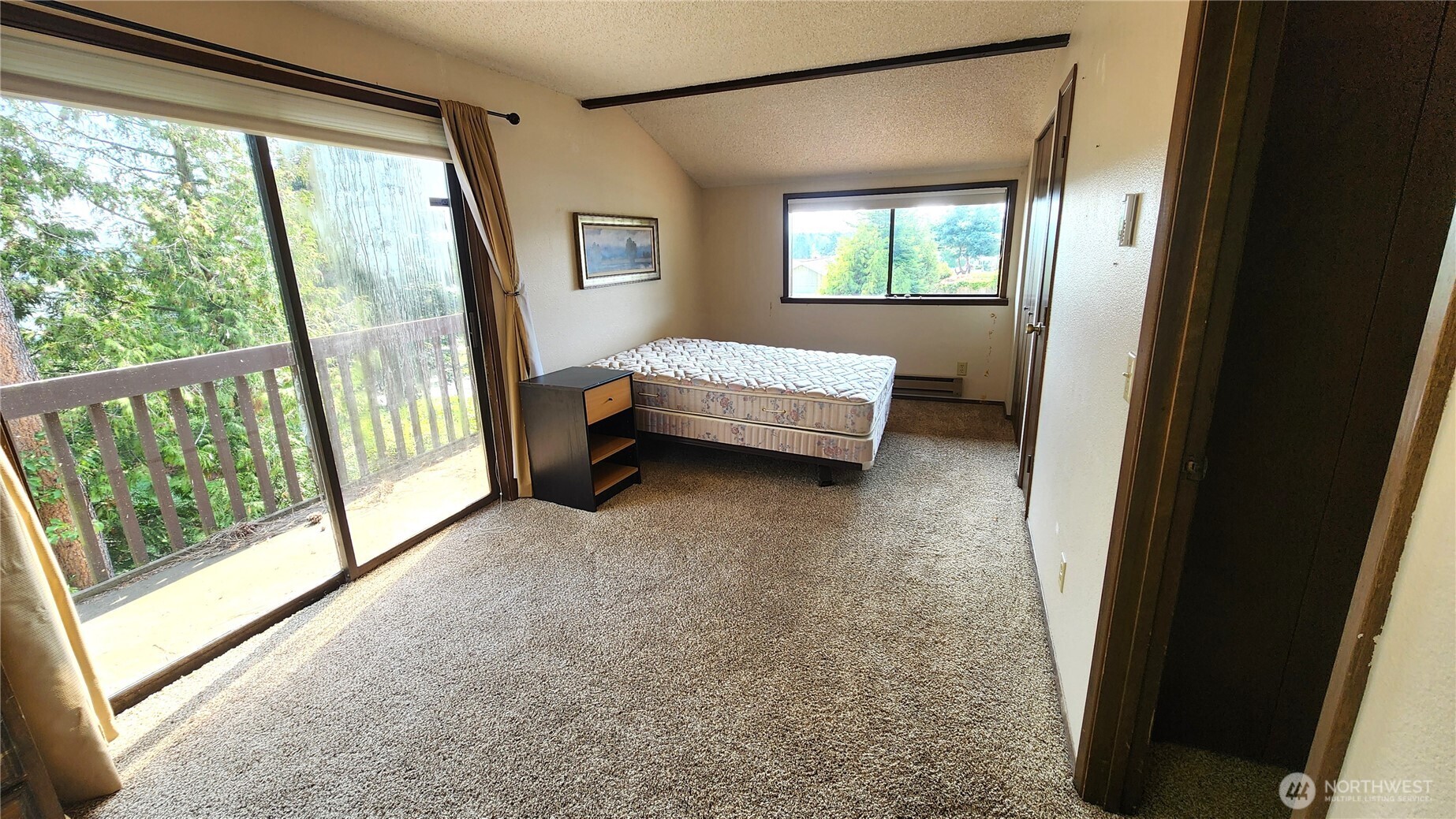 5556 Salish Road Blaine, WA 98230 - Photo 27 of 40 a bedroom with a bed and a window