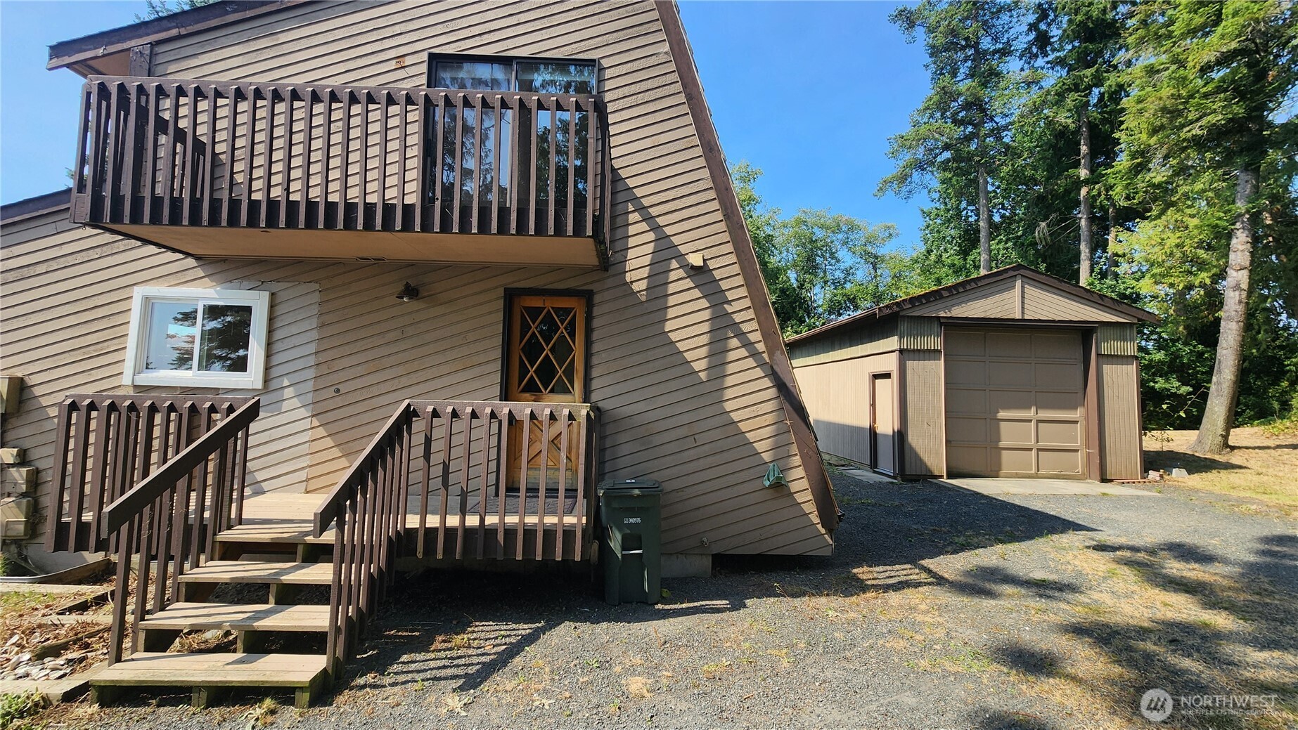 5556 Salish Road Blaine, WA 98230 - Photo 31 of 40 a view of a house with a deck