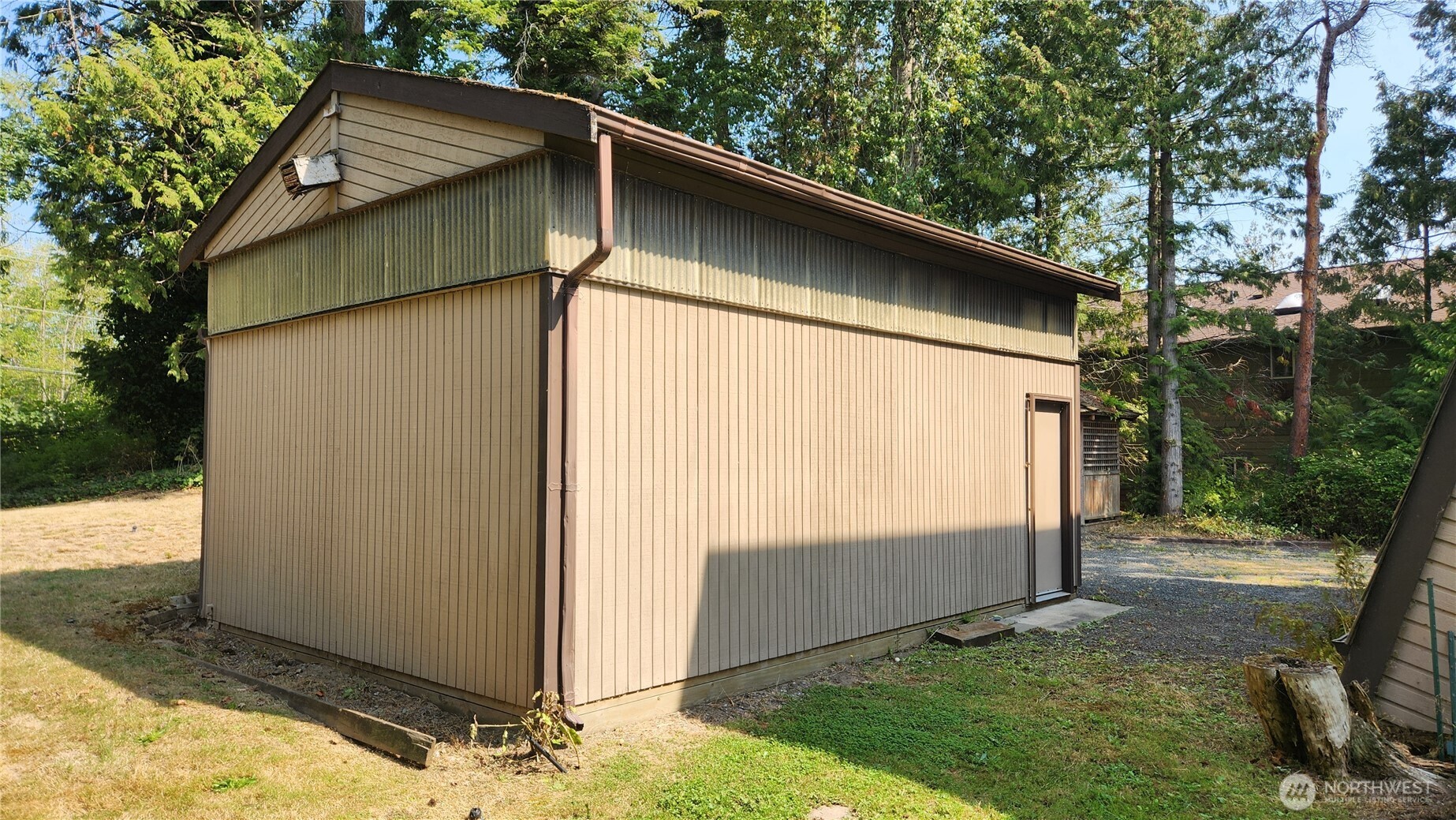 5556 Salish Road Blaine, WA 98230 - Photo 35 of 40 a backyard of a house with lots of green space