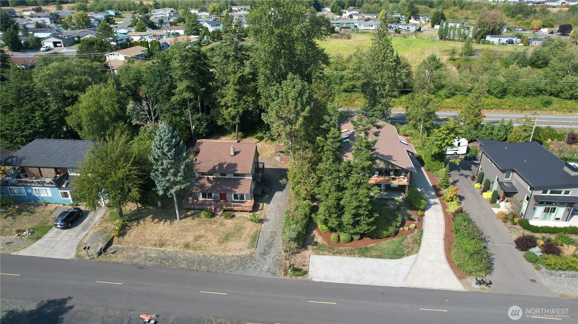 5556 Salish Road Blaine, WA 98230 - Photo 38 of 40 an aerial view of a house with a yard and lake view