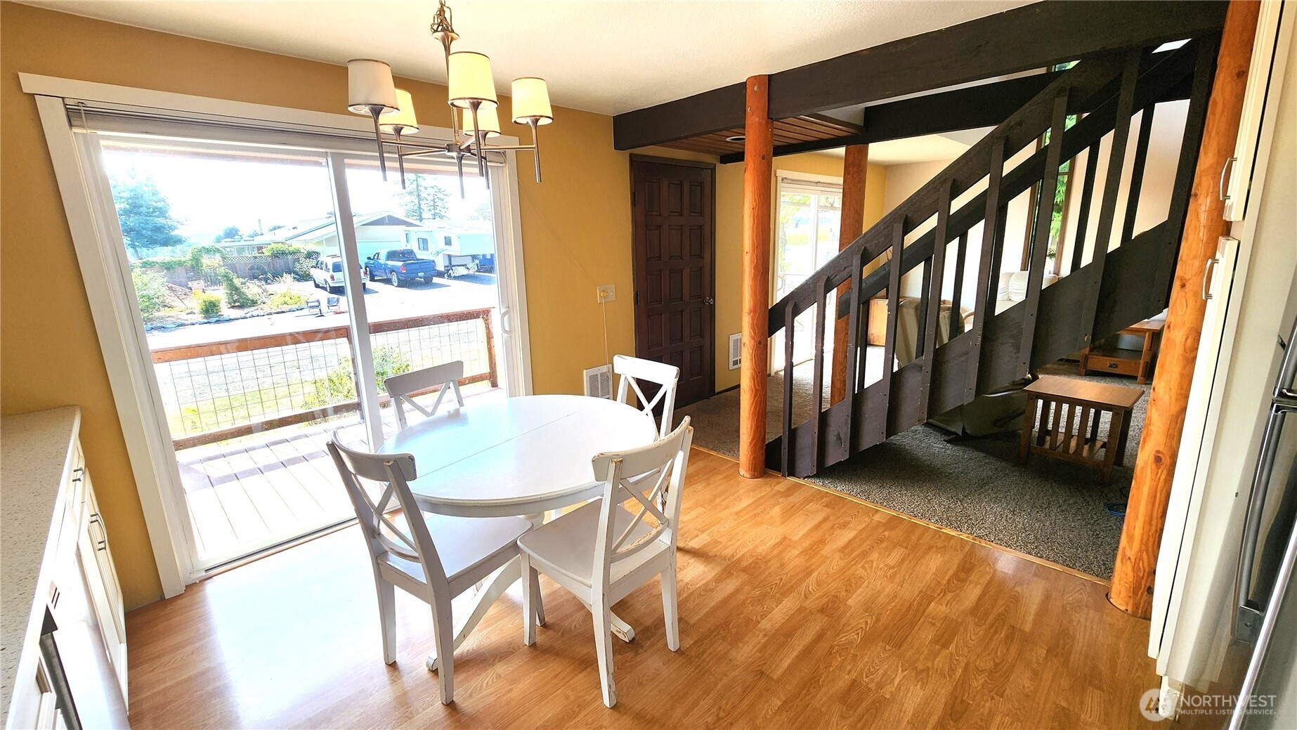 5556 Salish Road Blaine, WA 98230 - Photo 7 of 40 a dining room with furniture and a floor to ceiling window