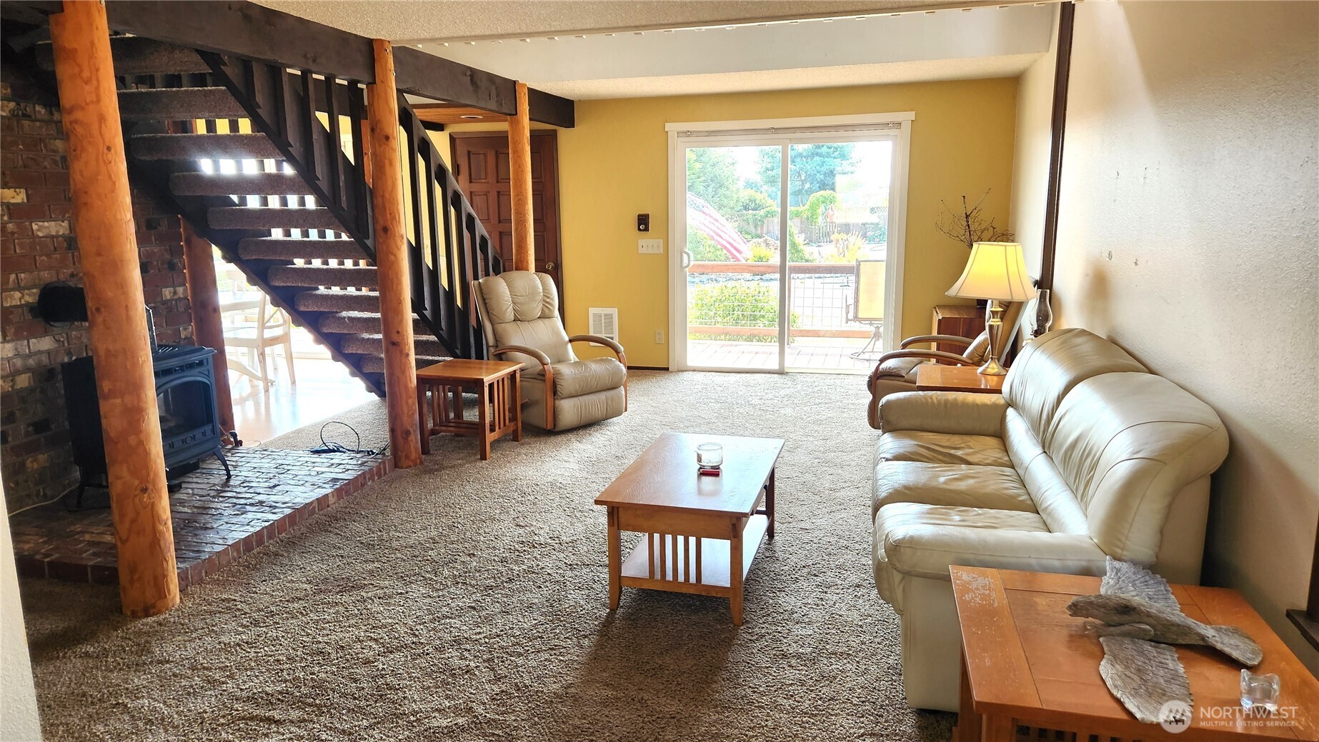 5556 Salish Road Blaine, WA 98230 - Photo 10 of 40 a living room with furniture and a floor to ceiling window