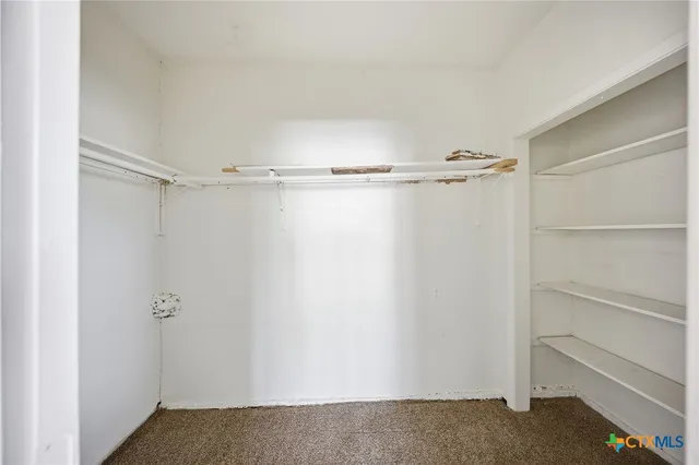 a view of an empty walk in closet