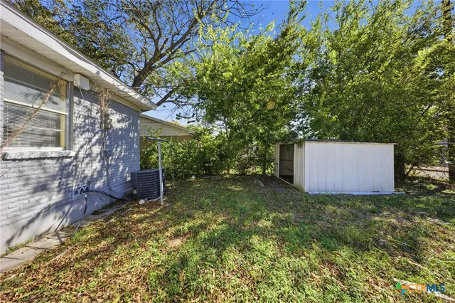 a backyard of a house with lots of green space