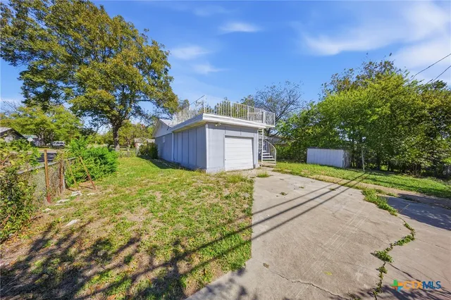 a house view with a outdoor space