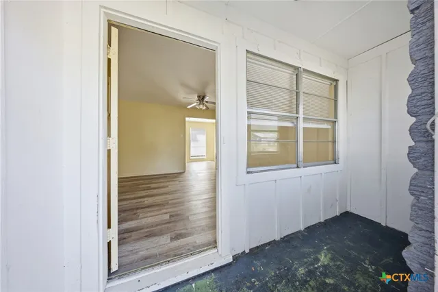 an empty room with windows