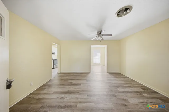 a view of an empty room and window