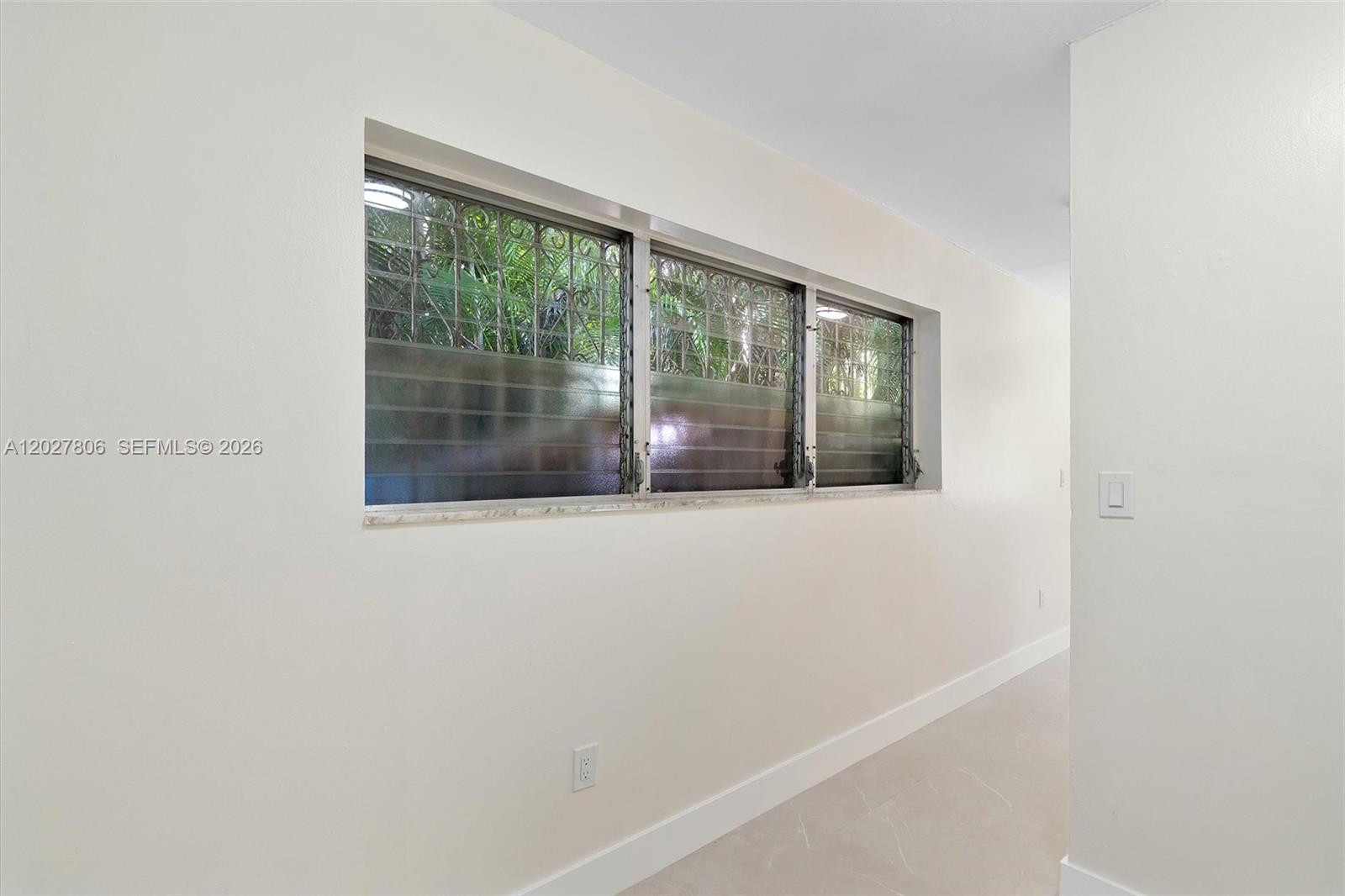 1612 Southwest 23rd Street, Unit 1612 Miami, FL 33145 - Photo 30 of 42 a view of empty room with wooden floor and fan