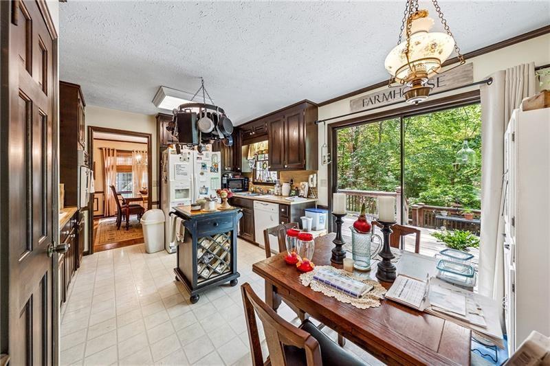315 Rhine Road Southeast White, GA 30184 - Photo 12 of 59 a view of a dining hall with furniture chandelier and a fireplace