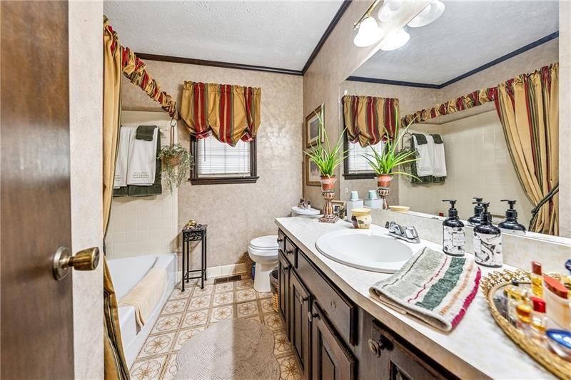 315 Rhine Road Southeast White, GA 30184 - Photo 17 of 59 a bathroom with a sink mirror and vanity