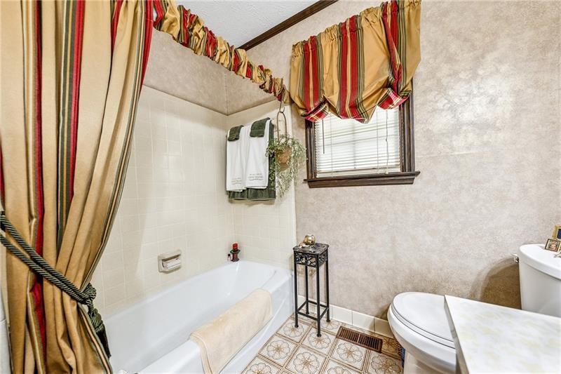 315 Rhine Road Southeast White, GA 30184 - Photo 18 of 59 a bathroom with a sink and a bathtub