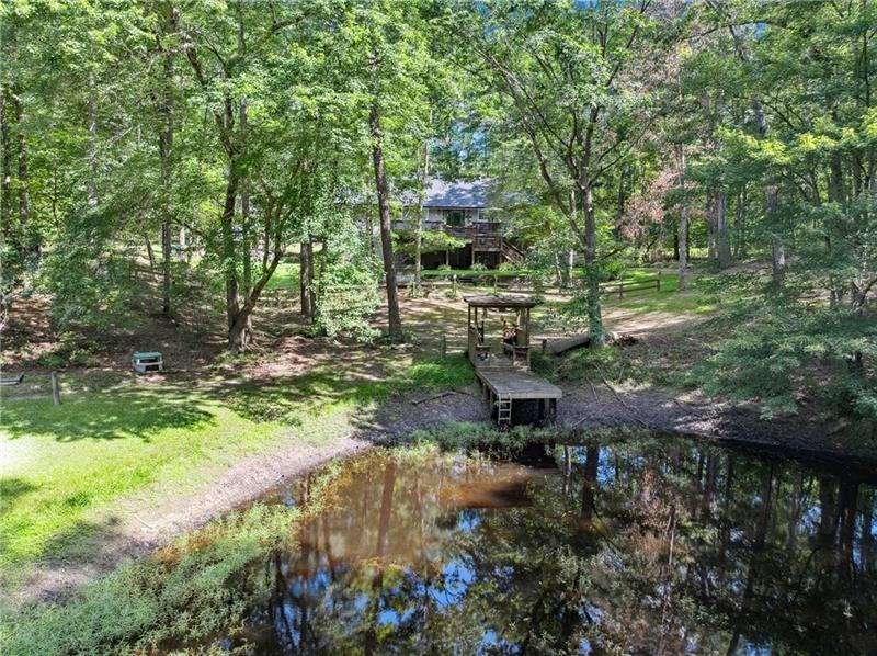 315 Rhine Road Southeast White, GA 30184 - Photo 24 of 59 a backyard of a house with a yard and outdoor seating