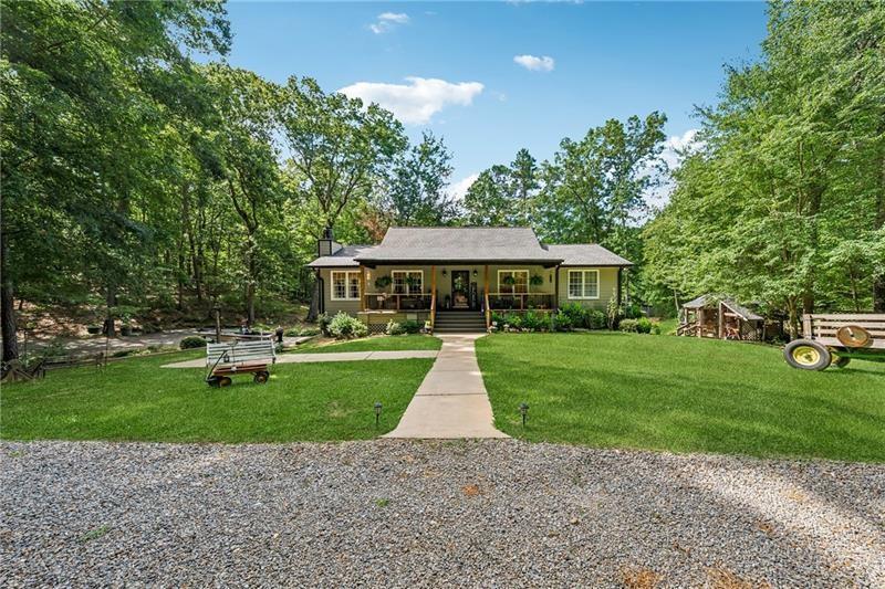 315 Rhine Road Southeast White, GA 30184 - Photo 3 of 59 a front view of a house with a yard