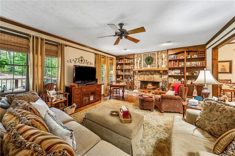 315 Rhine Road Southeast White, GA 30184 - Photo 6 of 59 a living room with furniture and a flat screen tv