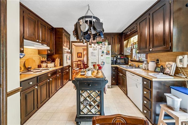 315 Rhine Road Southeast White, GA 30184 - Photo 9 of 59 a kitchen with stainless steel appliances granite countertop a sink dishwasher stove and refrigerator