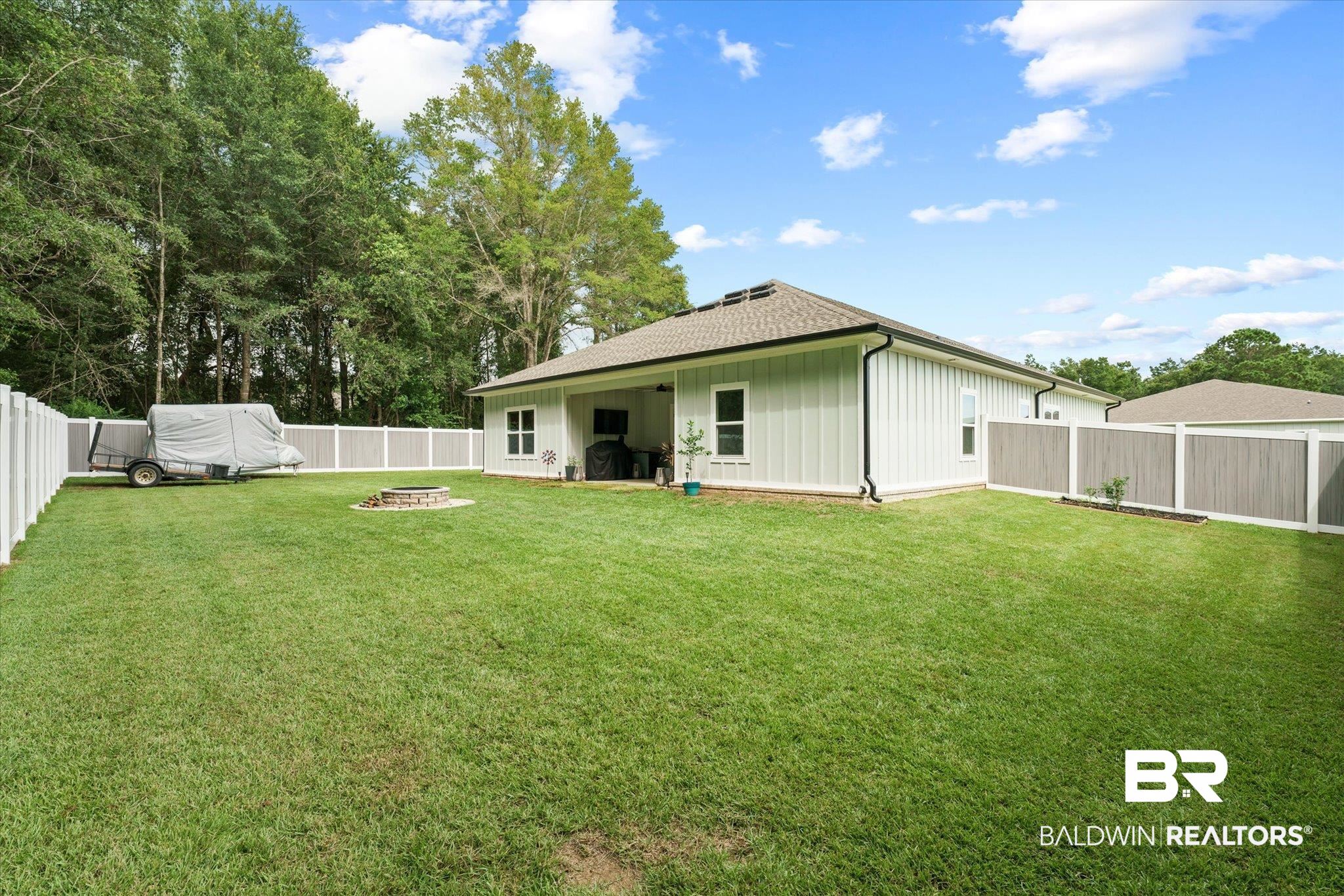 263 Bronze Street Fairhope, AL 36532 - Photo 30 of 47 View of yard with an outdoor fire pit