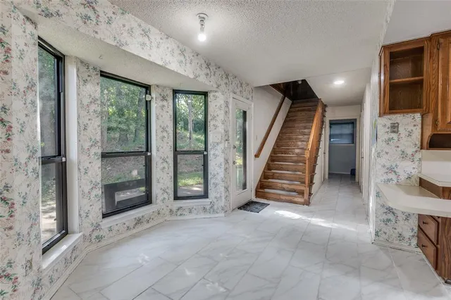 a view of entryway with stairs and wooden floor