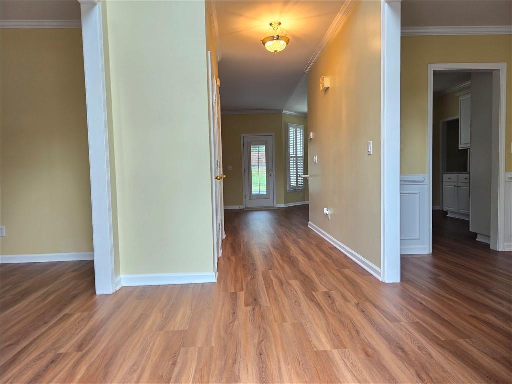 3715 Ridgeside Court Suwanee, GA 30024 - Photo 3 of 44 a view of a hallway with wooden floor