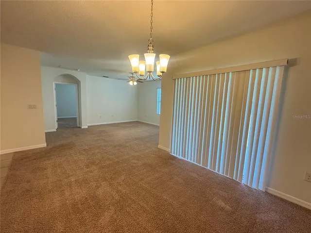 a view of a chandelier in hallway