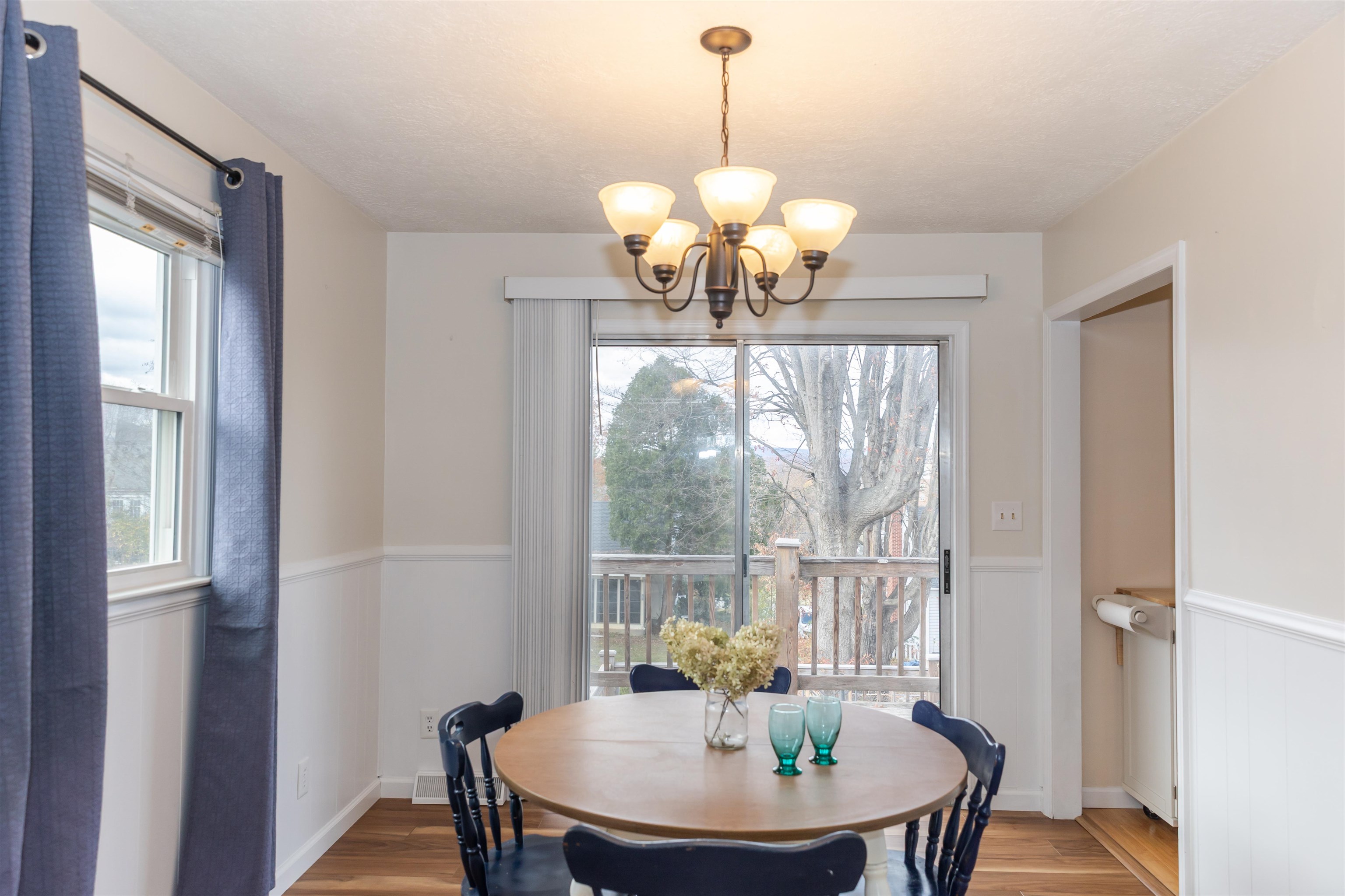 303 Summit Street Lexington, VA 24450 - Photo 11 of 58 a view of a dining room with furniture wooden floor and chandelier