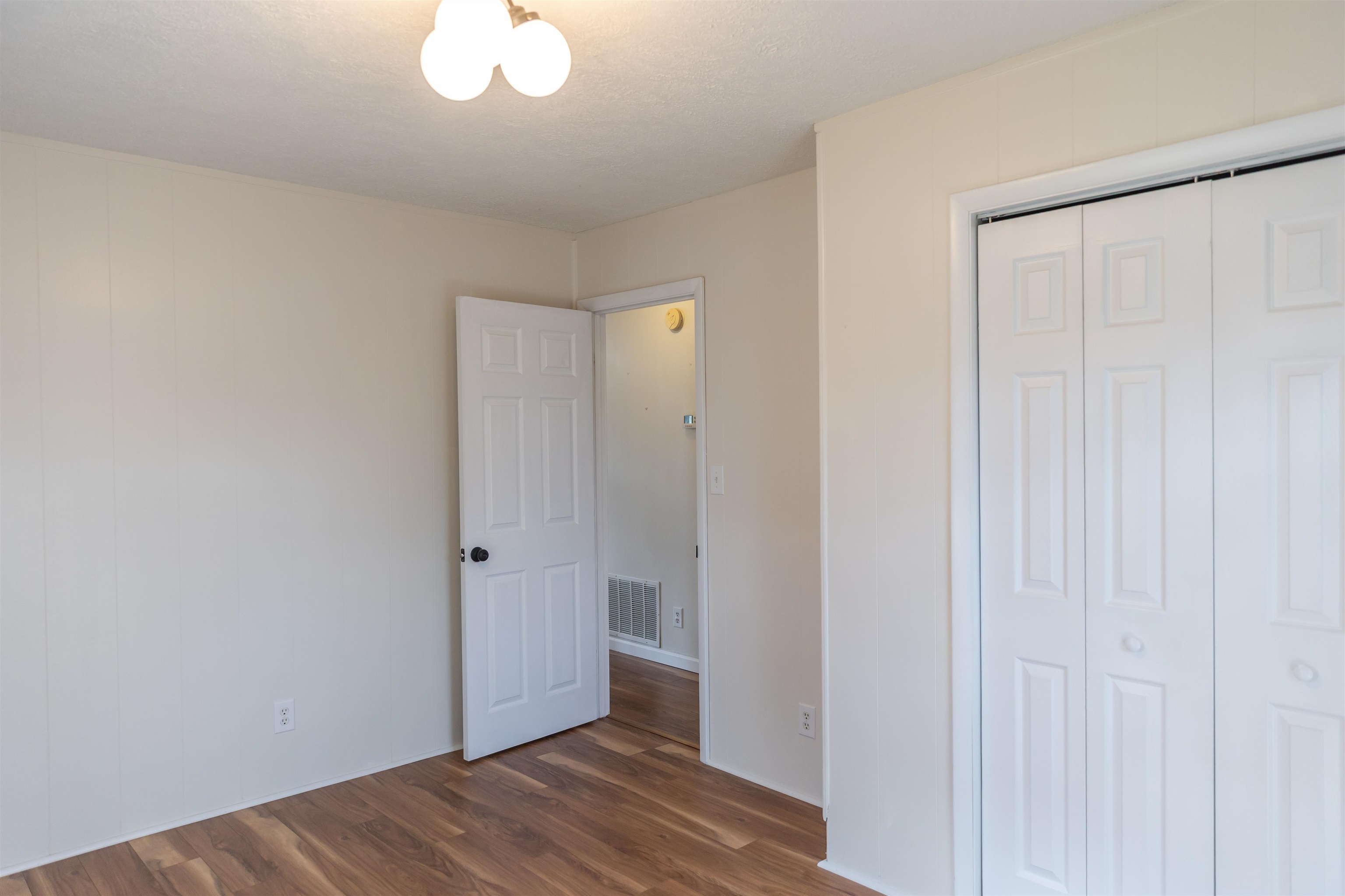 303 Summit Street Lexington, VA 24450 - Photo 33 of 58 a view of an empty room with wooden floor