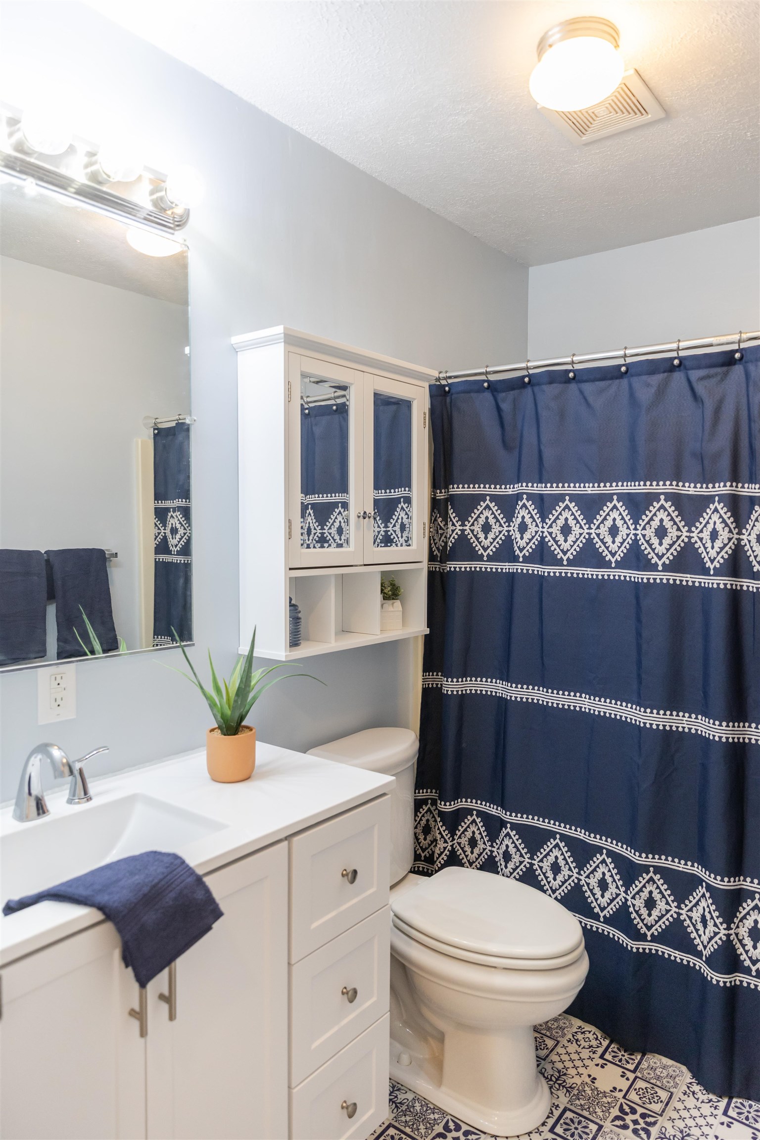 303 Summit Street Lexington, VA 24450 - Photo 39 of 58 a bathroom with a sink and a mirror