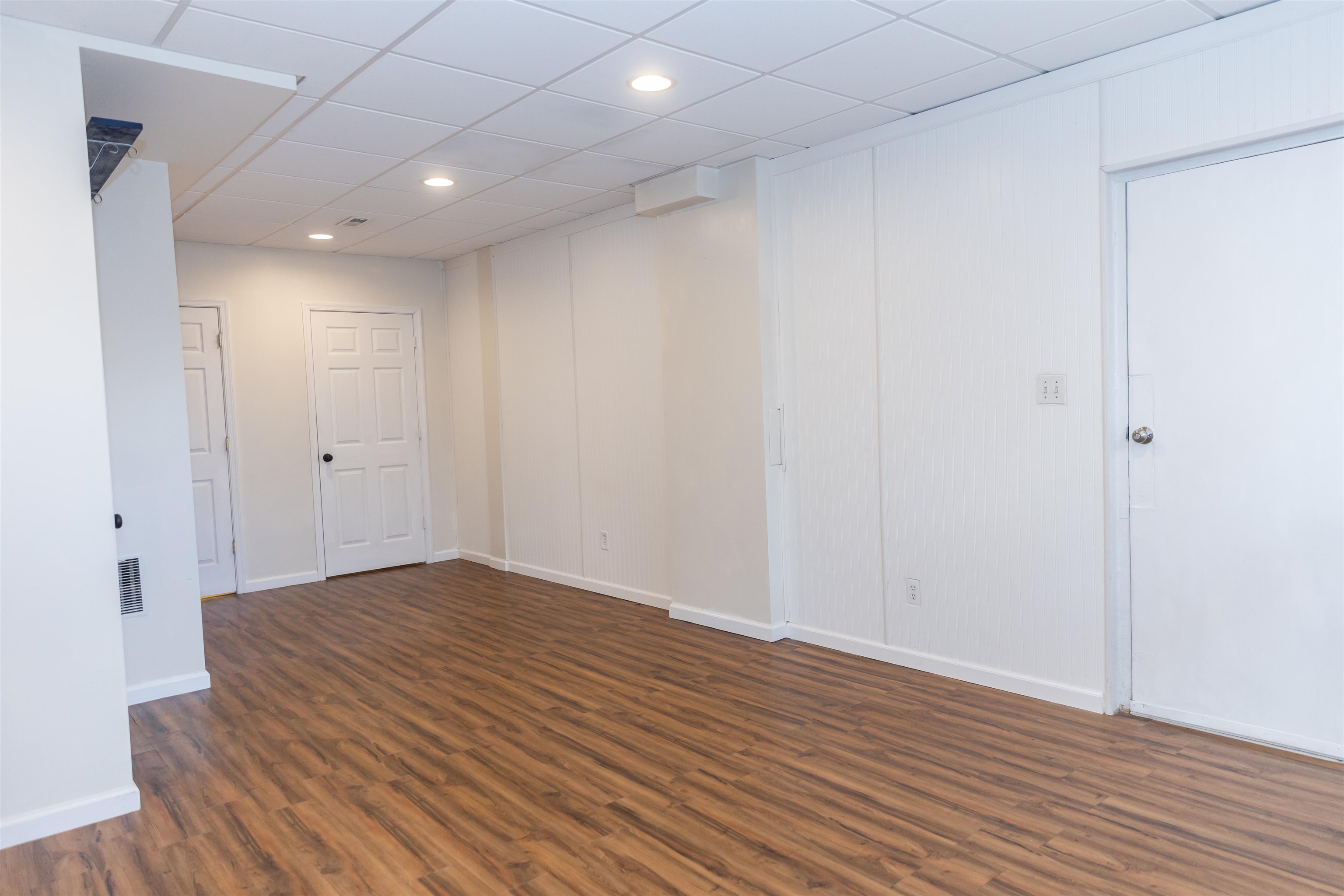 303 Summit Street Lexington, VA 24450 - Photo 42 of 58 a view of empty room with wooden floor