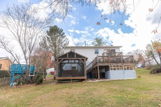 a view of a house with a yard covered with snow in the yard