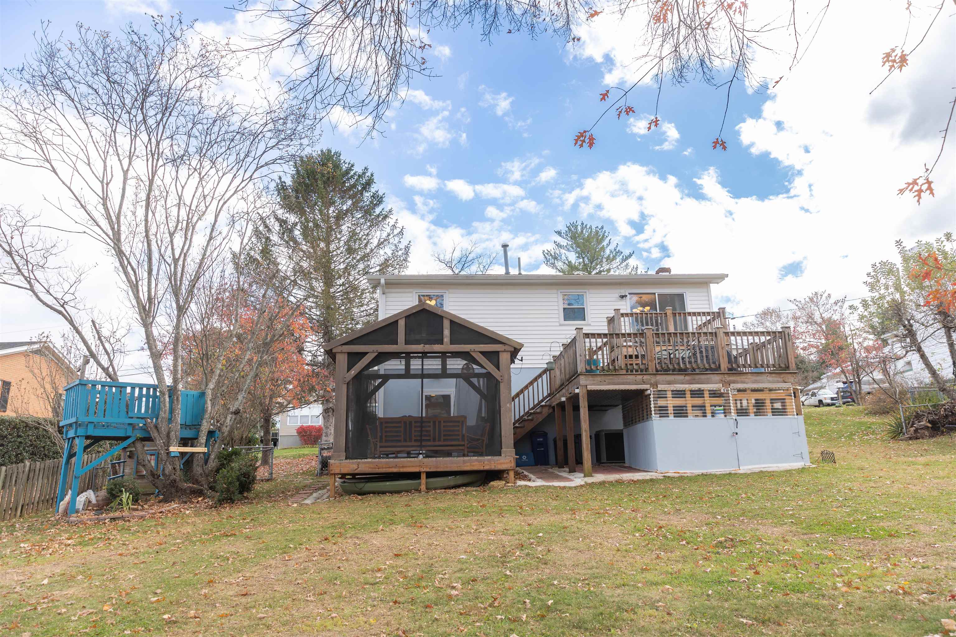 303 Summit Street Lexington, VA 24450 - Photo 46 of 58 a view of a big house with a large tree and a big yard
