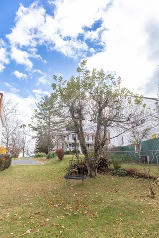 a view of a chair and tables on the roof deck