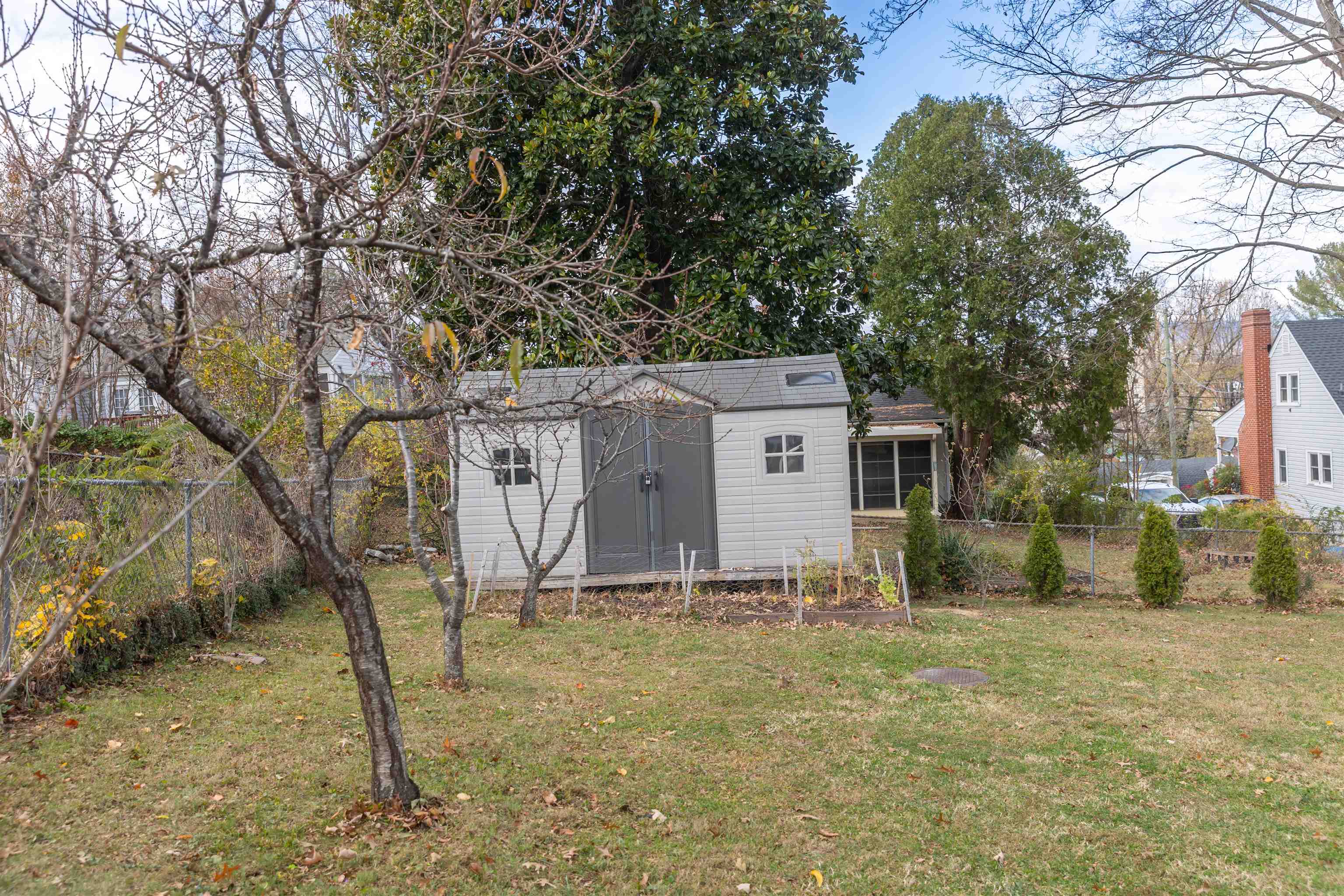 303 Summit Street Lexington, VA 24450 - Photo 49 of 58 a barn in the middle of a yard