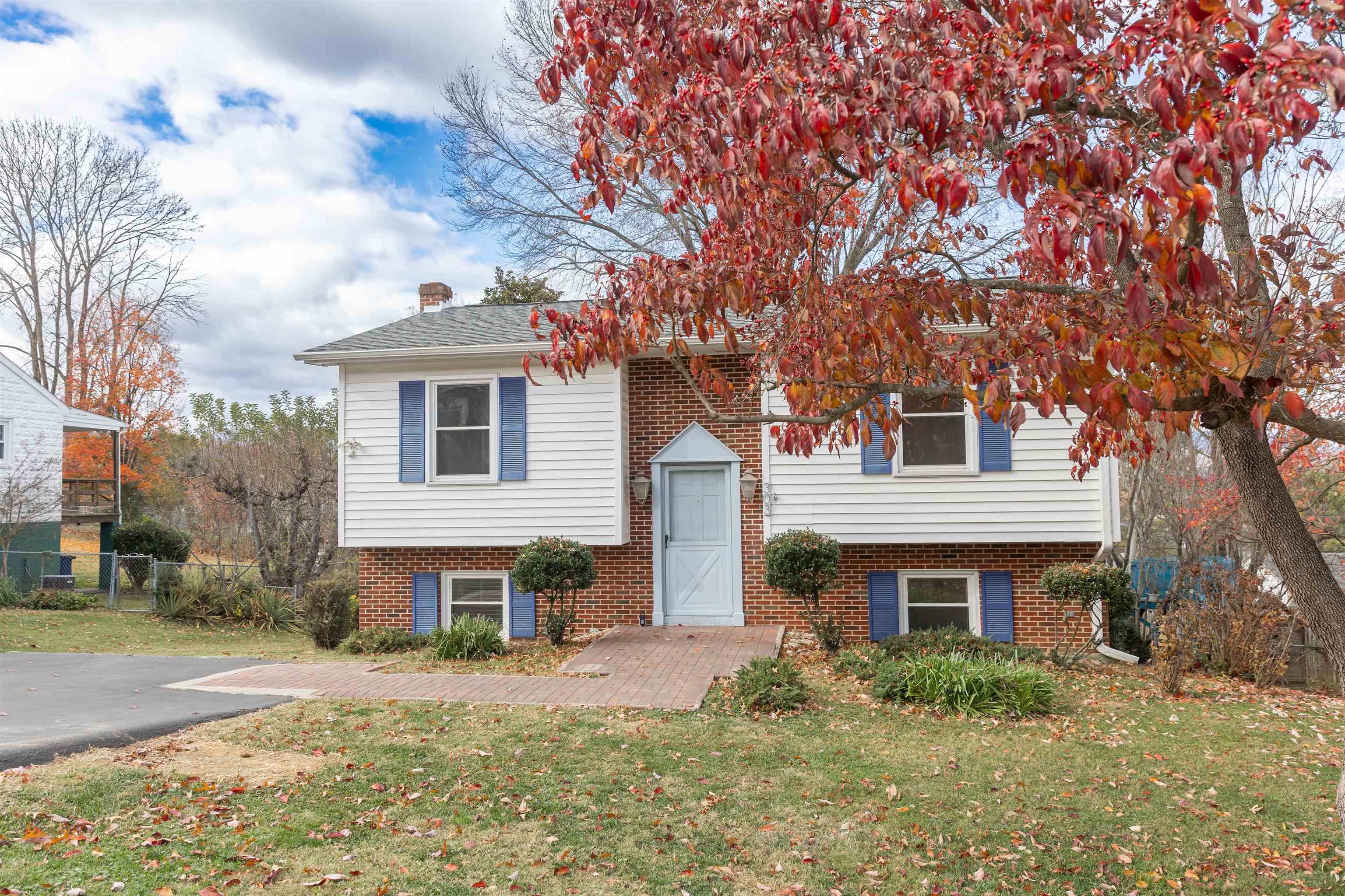 303 Summit Street Lexington, VA 24450 - Photo 5 of 58 a front view of a house with garden