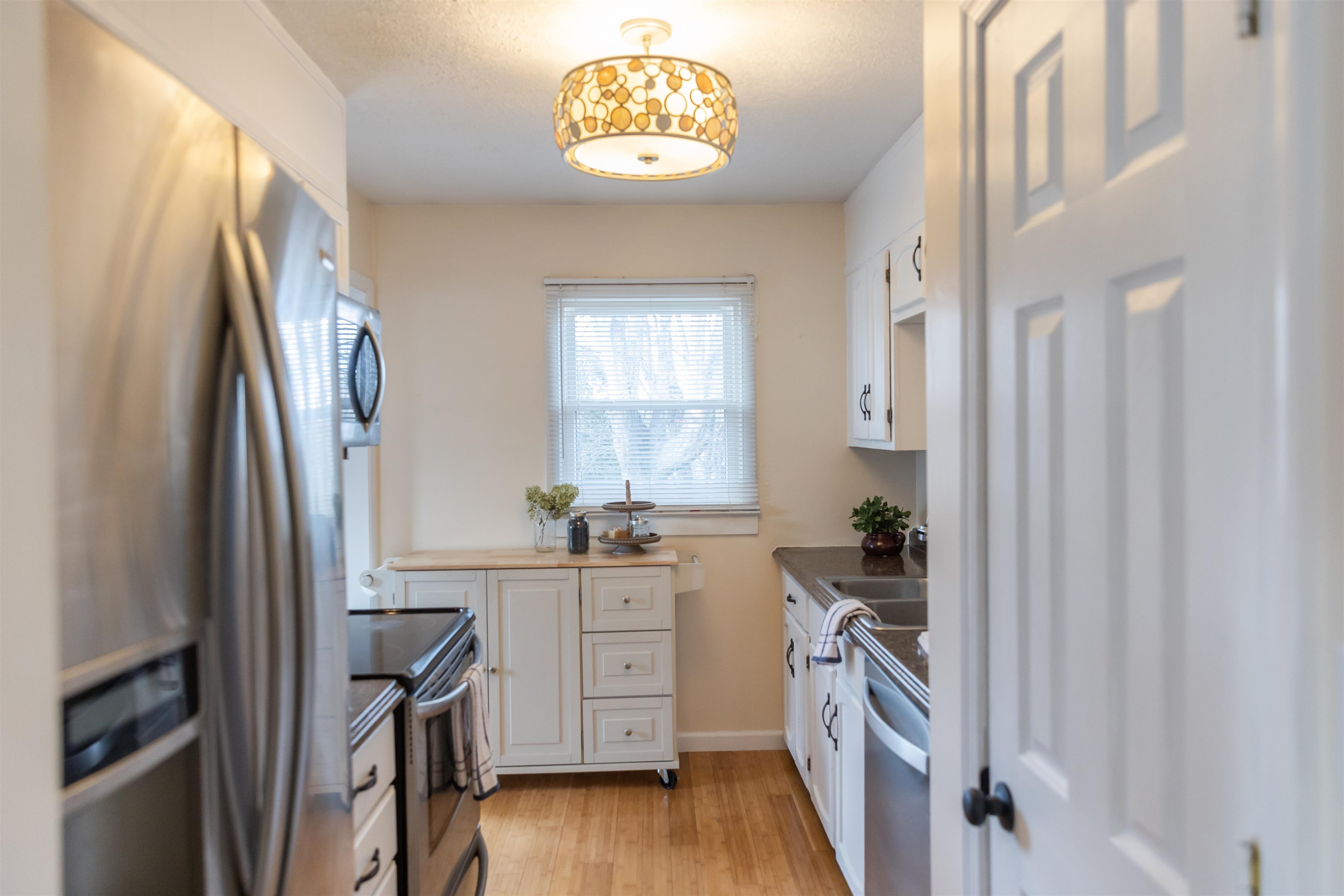 303 Summit Street Lexington, VA 24450 - Photo 7 of 58 a kitchen with stainless steel appliances a stove a refrigerator and a cabinets