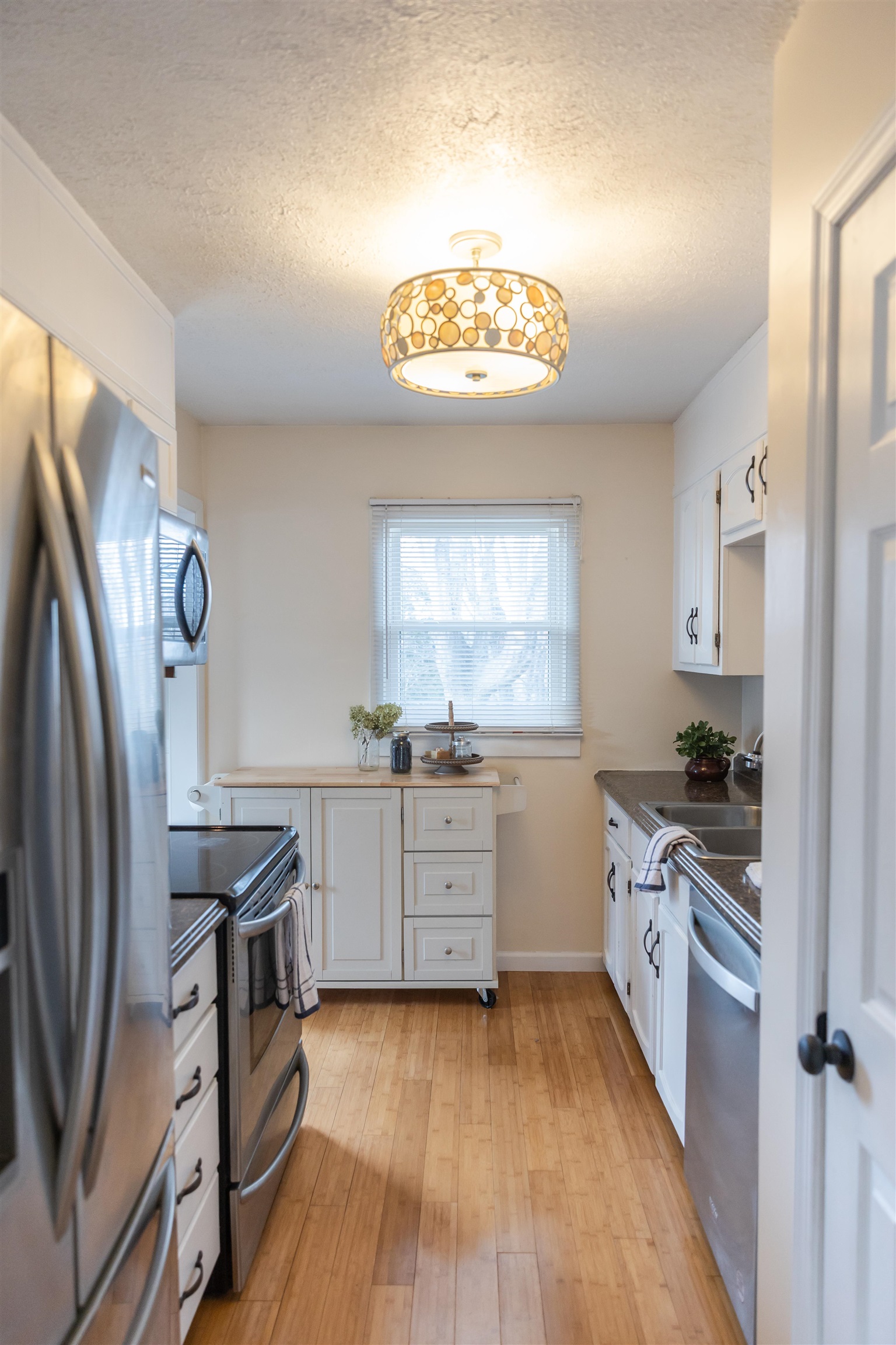 303 Summit Street Lexington, VA 24450 - Photo 8 of 58 a kitchen with stainless steel appliances granite countertop a stove a sink and a refrigerator