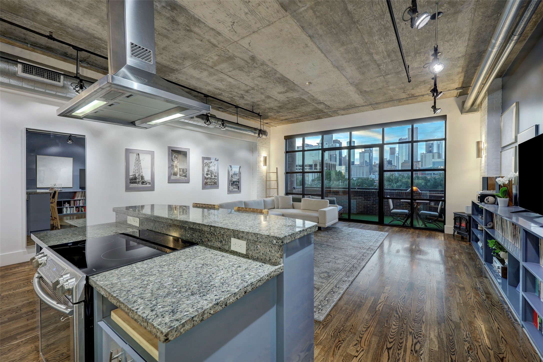 505 Bastrop Street, Unit 305 Houston, TX 77003 - Photo 11 of 15 a kitchen with counter top space and wooden floor