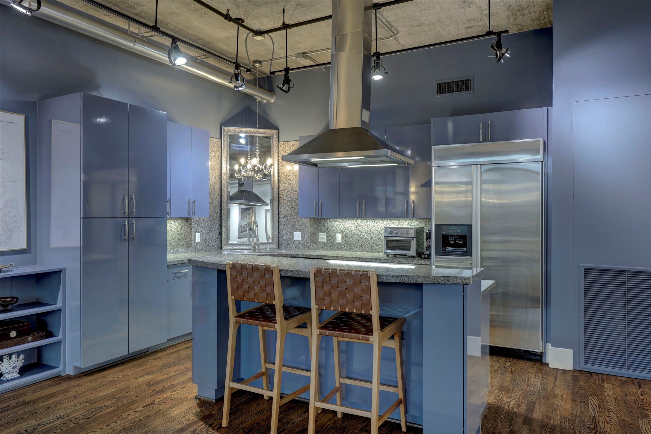 505 Bastrop Street, Unit 305 Houston, TX 77003 - Photo 12 of 15 a kitchen with stainless steel appliances granite countertop a sink and wooden cabinets