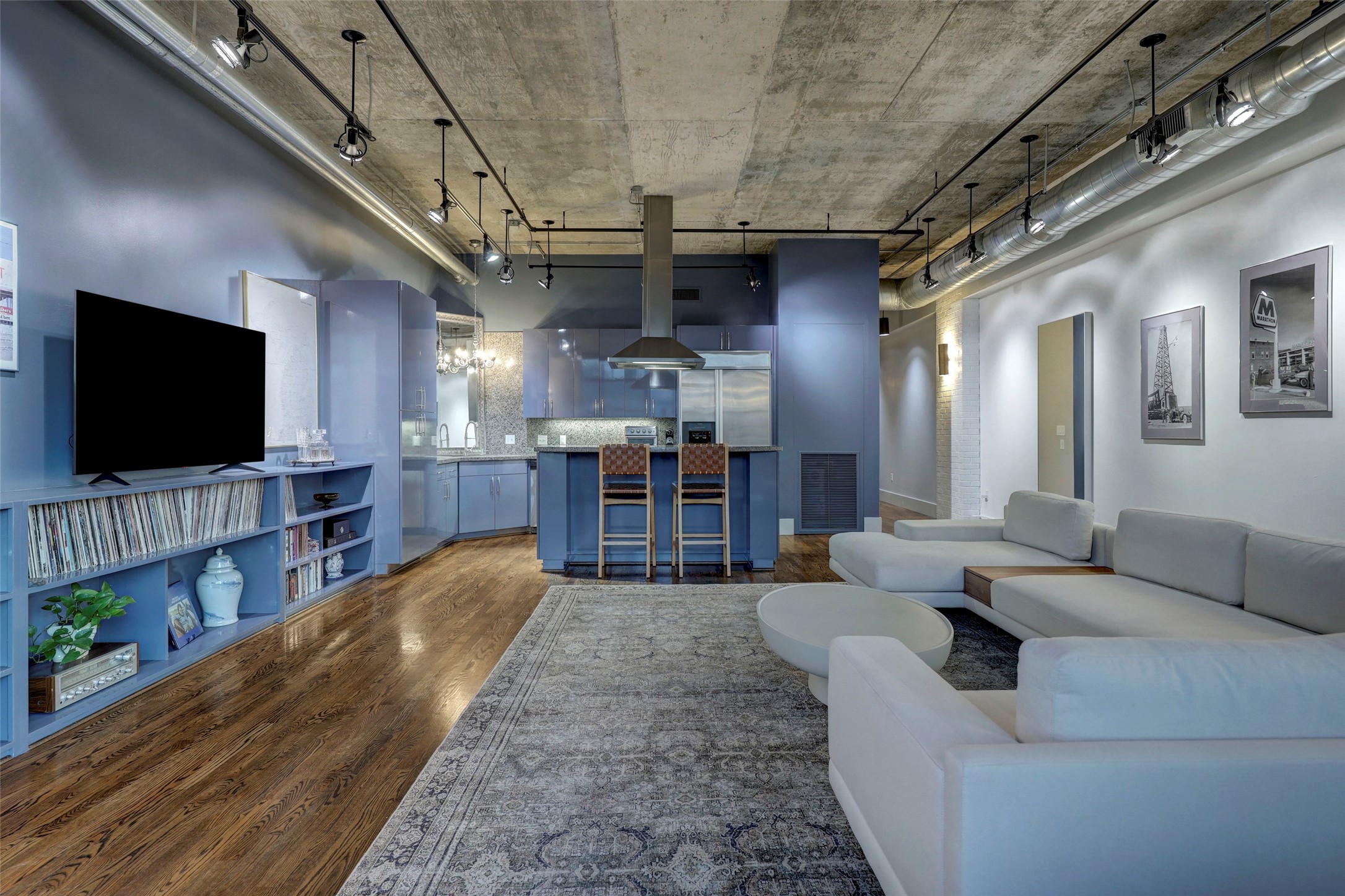 505 Bastrop Street, Unit 305 Houston, TX 77003 - Photo 13 of 15 a living room with furniture and a flat screen tv