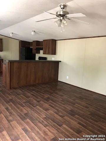 an empty room with wooden floor