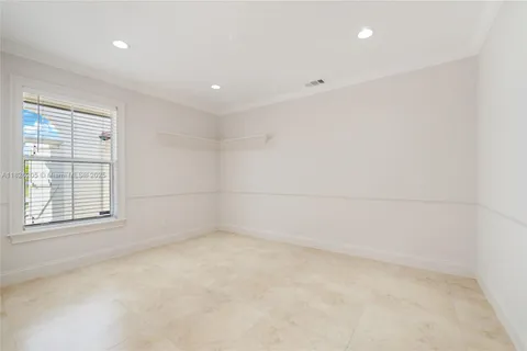 an empty room with a empty space and windows