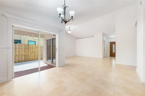 a view of an empty room with a bathroom